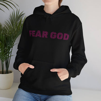 Person wearing black hoodie with 'Fear God' text