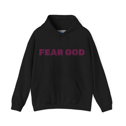 Black hoodie with 'Fear God' text on front